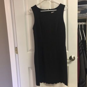 Black sheath dress with scalloped hemline